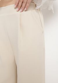Born2be - Jasnobeżowe Eleganckie Spodnie z Szerokimi Nogawkami Kahinuni. Kolor: beżowy. Materiał: tkanina. Wzór: gładki. Styl: elegancki #4