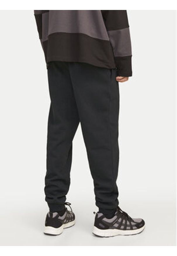 Jack & Jones - Jack&Jones Spodnie dresowe Gordon 12258477 Czarny Regular Fit. Kolor: czarny. Materiał: syntetyk, bawełna