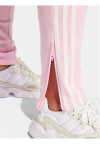 Adidas - adidas Spodnie dresowe adicolor SST IR8076 Różowy Slim Fit. Kolor: różowy. Materiał: bawełna #3