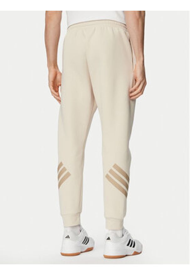 Adidas - adidas Spodnie dresowe Future Icons 3-Stripes KD5206 Beżowy Regular Fit. Kolor: beżowy. Materiał: bawełna