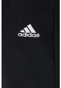 adidas Performance spodnie treningowe Versatile damskie kolor czarny proste high waist. Stan: podwyższony. Kolor: czarny. Materiał: materiał, skóra, tkanina. Wzór: ze splotem