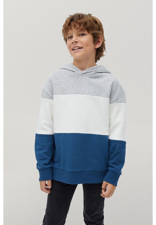 Mango Kids - Bluza bawełniana dziecięca BLOCK. Typ kołnierza: kaptur. Kolor: niebieski. Materiał: bawełna. Wzór: gładki