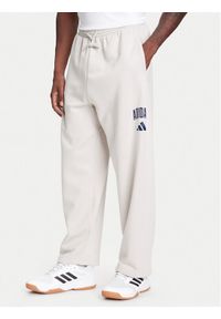 Adidas - adidas Spodnie dresowe Collegiate JM9177 Beżowy Regular Fit. Kolor: beżowy. Materiał: bawełna