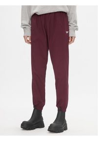 Reebok Spodnie dresowe Classics Franchise IL4627 Bordowy Relaxed Fit. Kolor: czerwony. Materiał: syntetyk