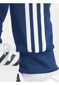 Adidas - adidas Spodnie dresowe adicolor Classics SST IR9887 Granatowy Slim Fit. Kolor: niebieski. Materiał: bawełna