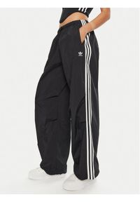 Adidas - adidas Spodnie dresowe 3-Stripes Woven Parachute IY7251 Czarny Loose Fit. Kolor: czarny. Materiał: syntetyk