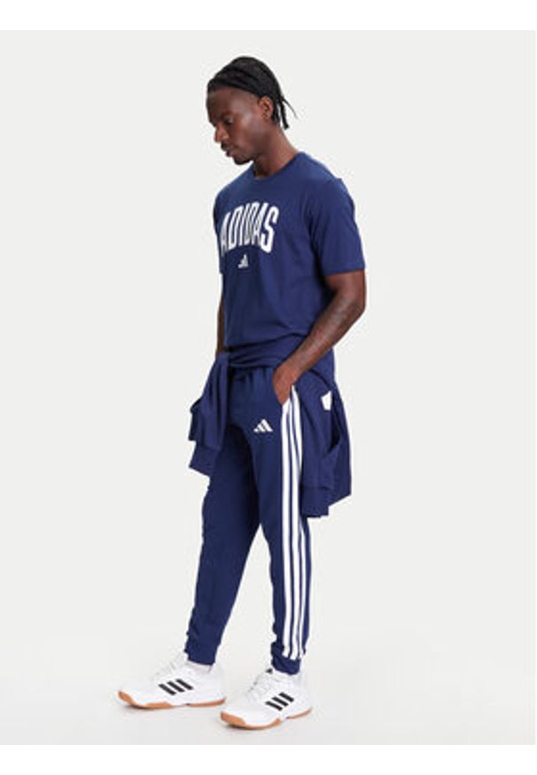 Adidas - adidas Spodnie dresowe Essential 3-Stripes JD1878 Niebieski Regular Fit. Kolor: niebieski. Materiał: syntetyk, bawełna