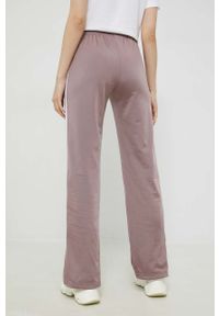 adidas Originals spodnie dresowe damskie kolor fioletowy gładkie. Kolor: fioletowy. Materiał: dresówka. Wzór: gładki #4