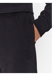 Hugo Spodnie dresowe 50500460 Czarny Relaxed Fit. Kolor: czarny. Materiał: bawełna