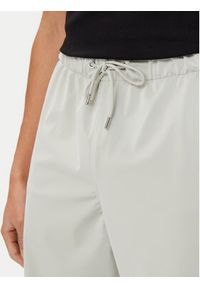 Rains Spodnie przeciwdeszczowe Unisex 18560 Beżowy Regular Fit. Kolor: beżowy. Materiał: syntetyk
