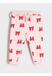 Sinsay - Spodnie dresowe z falbanką - begonia. Materiał: dresówka. Długość: długie #1