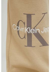 Calvin Klein Jeans spodnie dresowe damskie kolor beżowy z nadrukiem. Kolor: beżowy. Materiał: dresówka. Wzór: nadruk #2