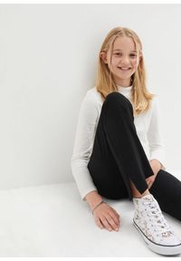 bonprix - Spodnie z poszerzaną nogawką z mieszanki bawełny organicznej z rozcięciami po bokach. Kolor: czarny. Materiał: bawełna #2