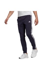 Adidas - Spodnie Essentials Single Jersey Tapered Open Hem 3-Stripes Rozmiar L Niebieski…. Kolor: niebieski. Materiał: jersey. Wzór: paski #1