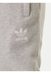 Adidas - adidas Spodnie dresowe Trefoil Essentials JY6271 Szary Slim Fit. Kolor: szary. Materiał: bawełna