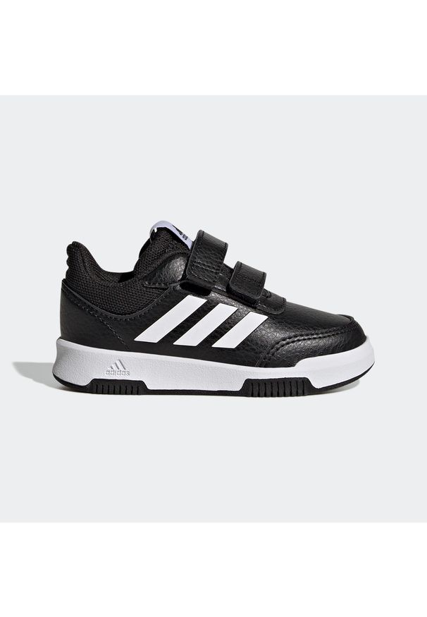 Adidas - Buty sportowe dla dzieci ADIDAS Tensaur. Okazja: na uczelnię. Zapięcie: pasek. Kolor: czarny, biały, wielokolorowy. Materiał: materiał. Szerokość cholewki: normalna. Wzór: paski. Sport: turystyka piesza