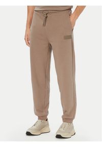 BOSS Spodnie dresowe JT_Long 50564096 Beżowy ciemny Relaxed Fit. Kolor: beżowy. Materiał: bawełna #1