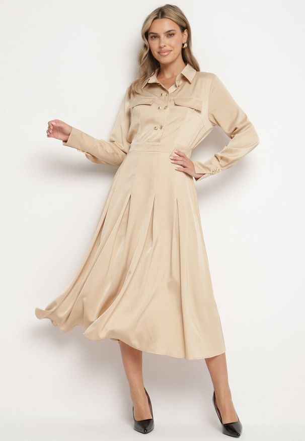 Born2be - Beżowa Rozkloszowana Sukienka o Koszulowym Kroju z Imitacją Kieszeni i Gumką w Talii Rizza. Okazja: na co dzień. Kolor: beżowy. Typ sukienki: koszulowe. Styl: elegancki, casual, klasyczny, wizytowy