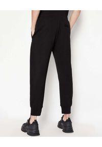 Armani Exchange - ARMANI EXCHANGE - Czarne spodnie dresowe z kontrastowym logo. Kolor: czarny. Materiał: dresówka