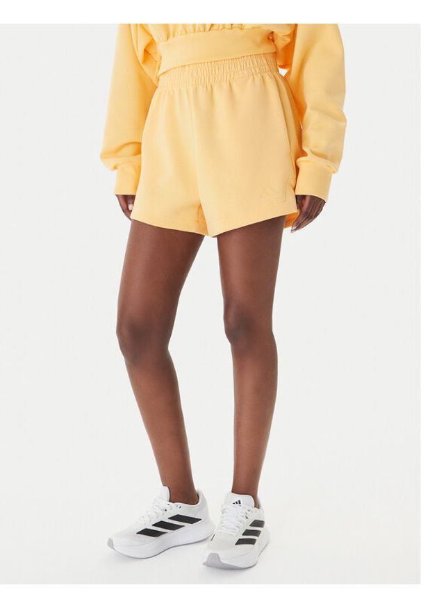 Adidas - adidas Szorty sportowe Soft Lux KA6998 Pomarańczowy Loose Fit. Kolor: pomarańczowy. Materiał: syntetyk