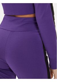 Puma Spodnie dresowe DUA LIPA 536629 Fioletowy Slim Fit. Kolor: fioletowy. Materiał: syntetyk
