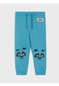 Sinsay - Spodnie dresowe z aplikacją 3d Kung fu Panda - niebieski. Kolor: niebieski. Materiał: dresówka. Wzór: aplikacja