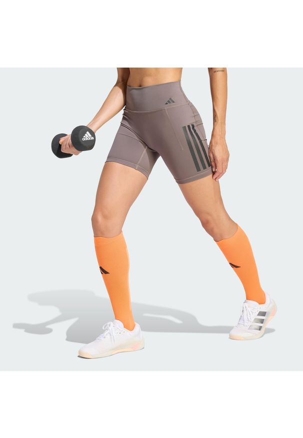 Adidas - Krótkie legginsy Optime Workout 3-Stripes. Stan: podwyższony. Kolor: szary, wielokolorowy, brązowy. Materiał: skóra, lycra. Długość: krótkie. Sport: fitness