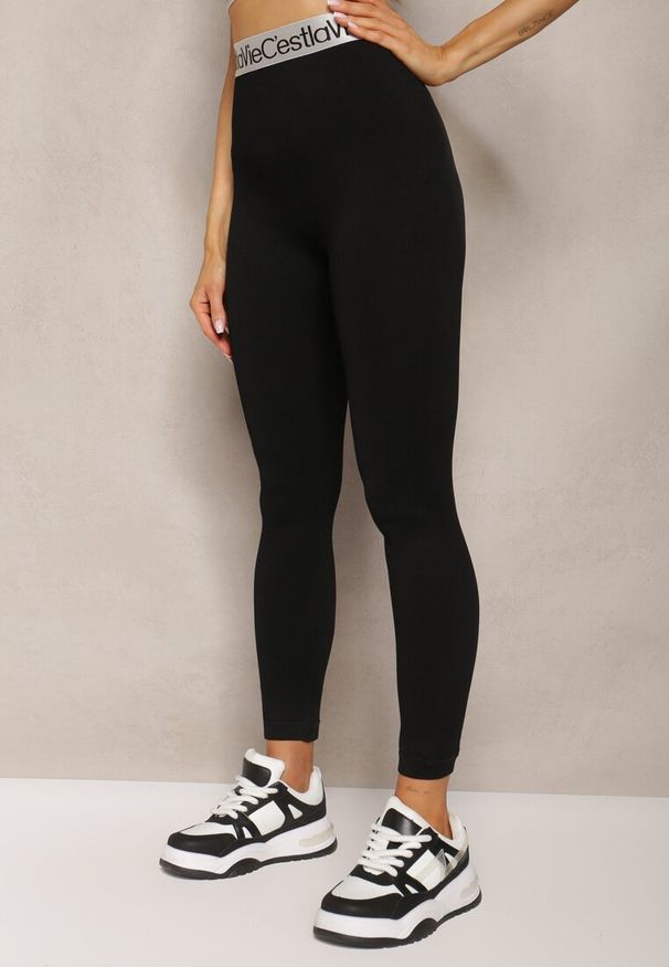 Renee - Czarne Sportowe Legginsy Elastyczne z Ozdobną Szeroką Gumą w Pasie Larnode. Okazja: na co dzień. Kolor: czarny. Materiał: guma. Styl: sportowy
