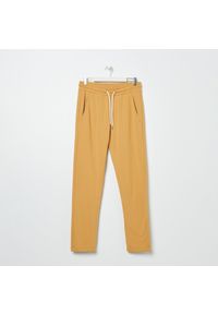 Sinsay - Spodnie dresowe slim jogger - Żółty. Kolor: żółty. Materiał: dresówka #1