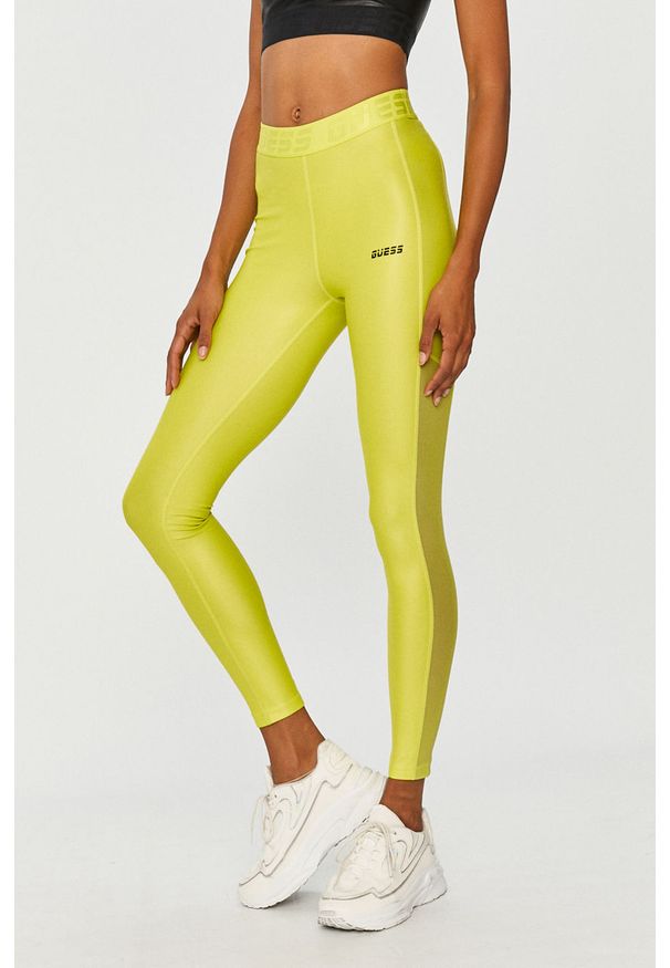 Guess Jeans - Legginsy. Kolor: żółty, zielony, wielokolorowy. Materiał: poliester, dzianina, poliamid, elastan. Wzór: gładki