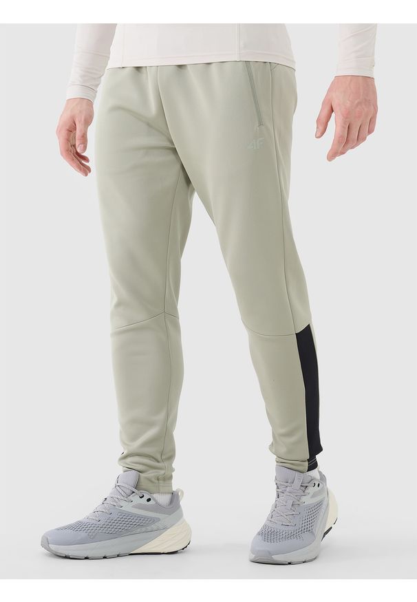 4f - 4F Spodnie treningowe szybkoschnące męskie - khaki XXL. Kolor: brązowy, wielokolorowy, oliwkowy. Materiał: dzianina, materiał, dresówka, syntetyk, włókno, elastan. Wzór: ze splotem, jednolity. Sport: fitness