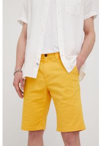 Tommy Jeans szorty SCANTON DM0DM13221.PPYY męskie kolor żółty. Kolor: żółty. Materiał: tkanina, materiał. Wzór: gładki