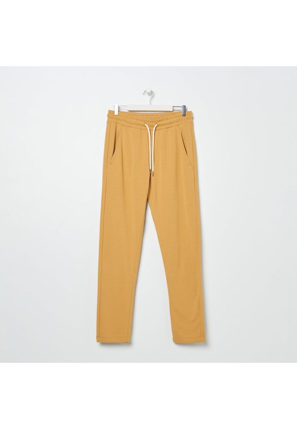 Sinsay - Spodnie dresowe slim jogger - Żółty. Kolor: żółty. Materiał: dresówka