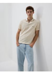 Reserved - Jeansy carrot fit - niebieski. Kolor: niebieski
