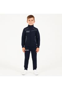 LEGEA - Komplet dresowy dla chłopca TEXAS JUNIOR JR. Okazja: na uczelnię. Kolor: niebieski, wielokolorowy, biały. Materiał: dresówka. Styl: sportowy #1