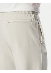 Calvin Klein Spodnie dresowe LV04LG212G Beżowy Regular Fit. Kolor: beżowy. Materiał: bawełna #4