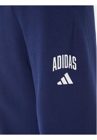 Adidas - adidas Spodnie dresowe Collegiate JM9179 Niebieski Regular Fit. Kolor: niebieski. Materiał: syntetyk #4