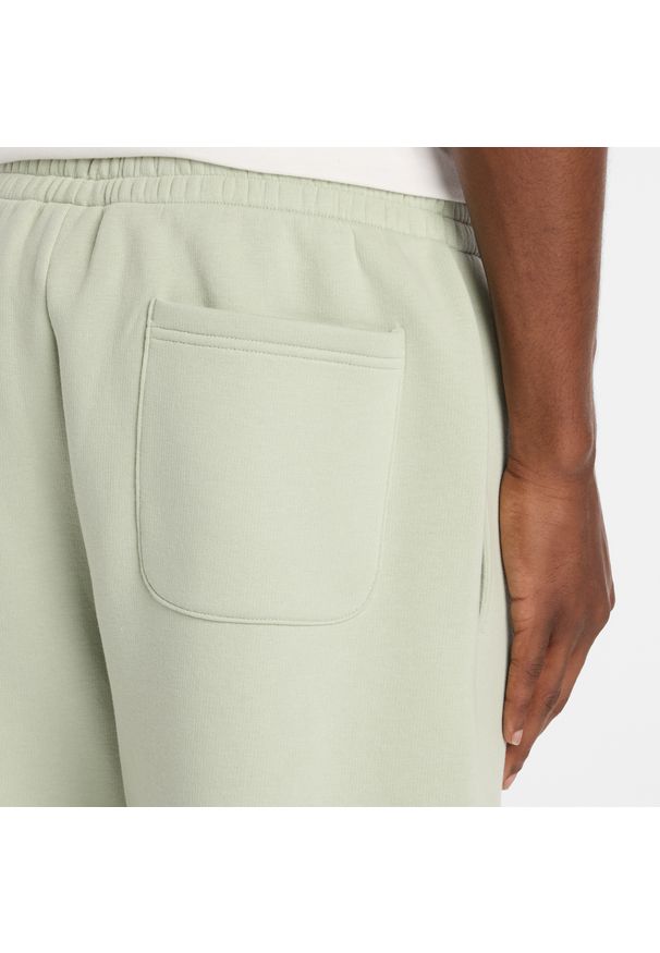 Spodnie męskie New Balance MP41503GAS – miętowe. Kolor: miętowy. Materiał: poliester, dresówka, materiał, bawełna