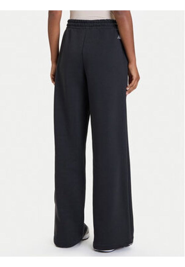 New Balance Spodnie dresowe WP53902 Czarny Relaxed Fit. Kolor: czarny. Materiał: bawełna