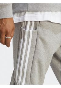 Adidas - adidas Spodnie dresowe Essentials French Terry Tapered Cuff 3-Stripes Joggers IC9407 Szary Regular Fit. Kolor: szary. Materiał: bawełna