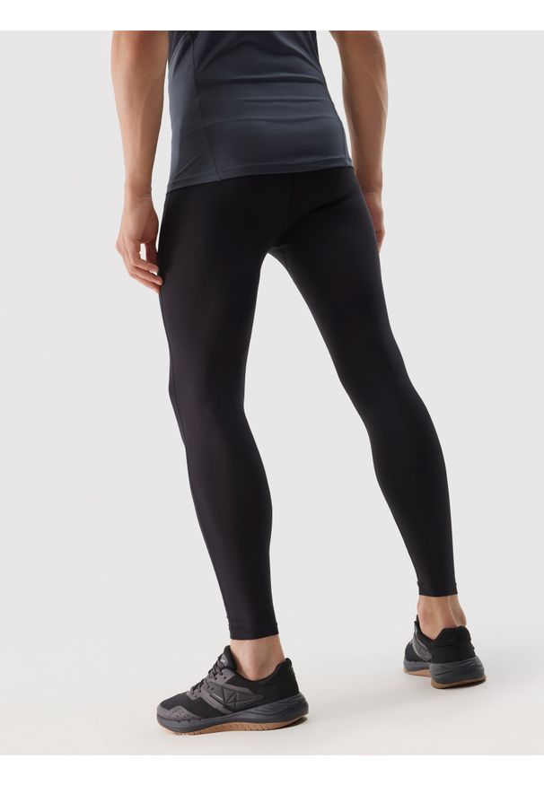 4f - 4F Legginsy treningowe szybkoschnace męskie - czarne S. Kolor: czarny. Materiał: poliester, materiał, elastan, włókno, dzianina. Wzór: jednolity, gładki, ze splotem. Sport: fitness