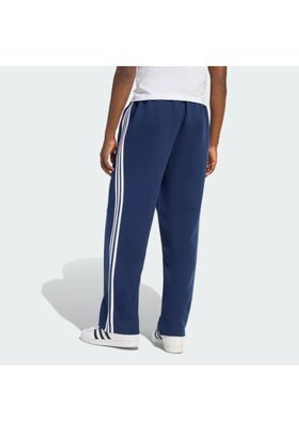 Adidas - adidas Spodnie dresowe adicolor Spacer Track KD4087 Granatowy Baggy Fit. Kolor: niebieski. Materiał: syntetyk. Sport: turystyka piesza