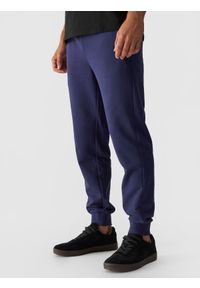 4f - 4F Spodnie dresowe joggery męskie - granatowe XL. Kolor: niebieski. Materiał: dresówka. Wzór: gładki, ze splotem
