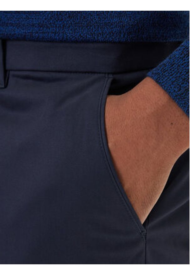 Calvin Klein Chinosy LV04LD613G Granatowy Slim Fit. Kolor: niebieski. Materiał: bawełna