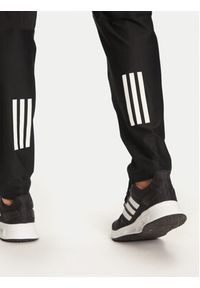 Adidas - adidas Spodnie dresowe Own The Run IK5024 Czarny Regular Fit. Kolor: czarny. Materiał: syntetyk. Sport: bieganie #3