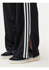 Adidas - adidas Spodnie dresowe adicolor Classic Firebird JC8245 Czarny Loose Fit. Kolor: czarny. Materiał: syntetyk #5