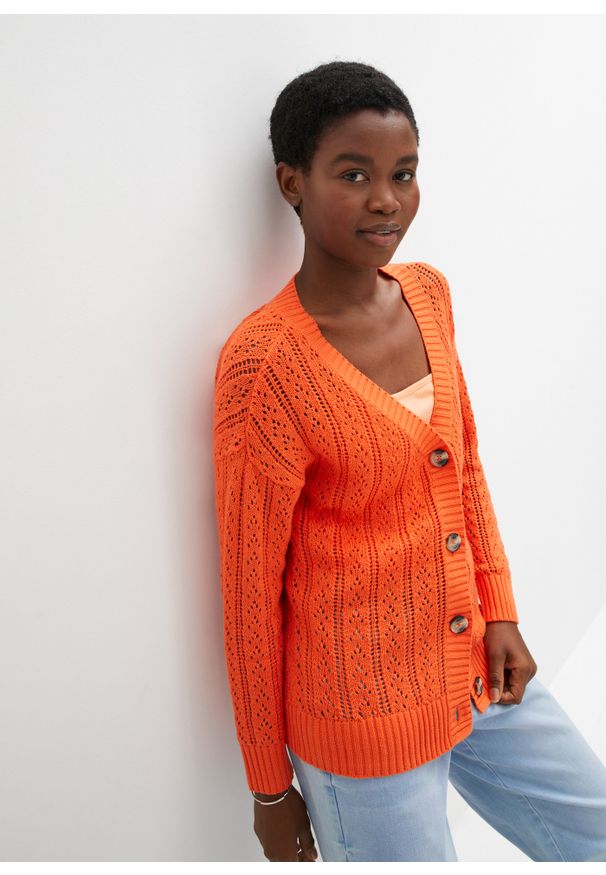 bonprix - Sweter rozpinany w ażurowy wzór. Kolor: pomarańczowy. Wzór: ażurowy