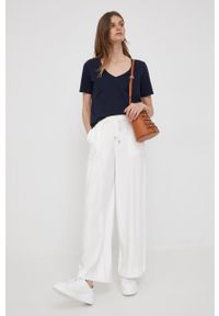 DKNY - Dkny spodnie damskie kolor beżowy szerokie high waist. Stan: podwyższony. Kolor: beżowy. Materiał: tkanina