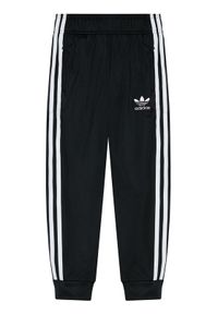 Adidas - adidas Spodnie dresowe Sst Track GN8453 Czarny Regular Fit. Kolor: czarny. Materiał: syntetyk #1