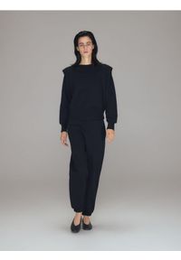 Reserved - Dresowe spodnie - czarny. Kolor: czarny. Materiał: dresówka